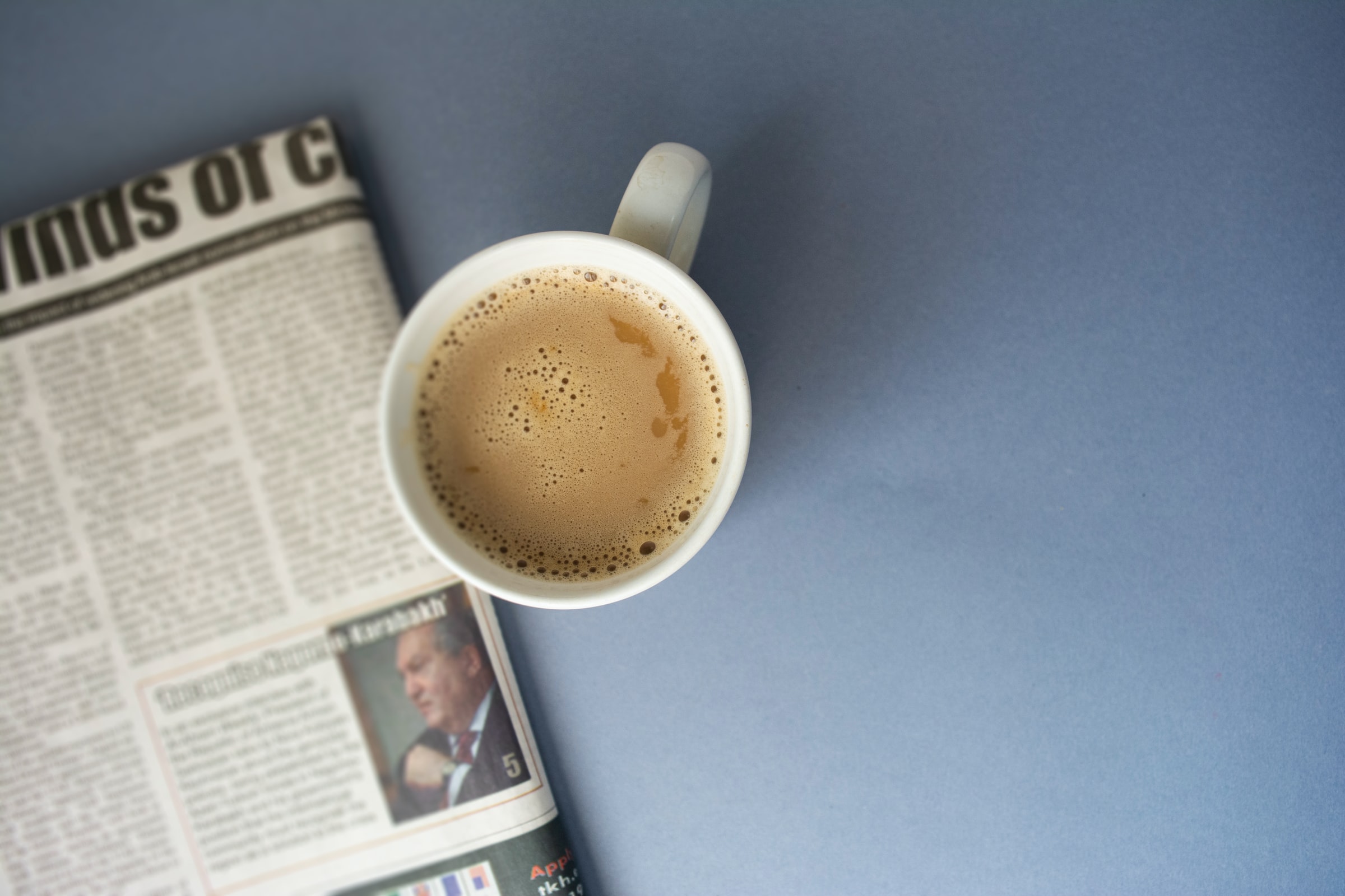 A cup of coffee and a daily newspaper